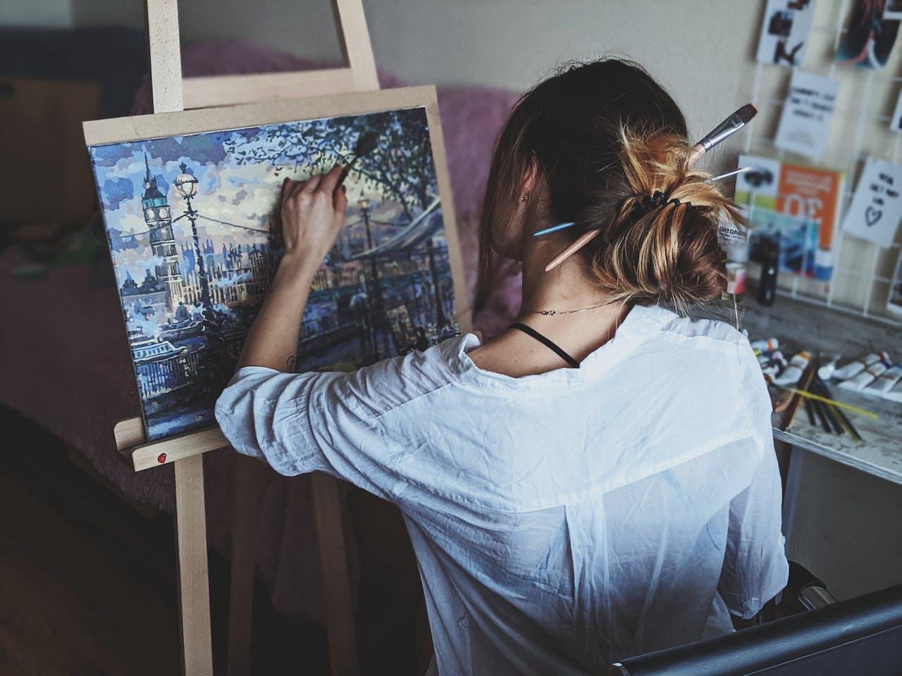 Photo Of Woman In Front Of Painting